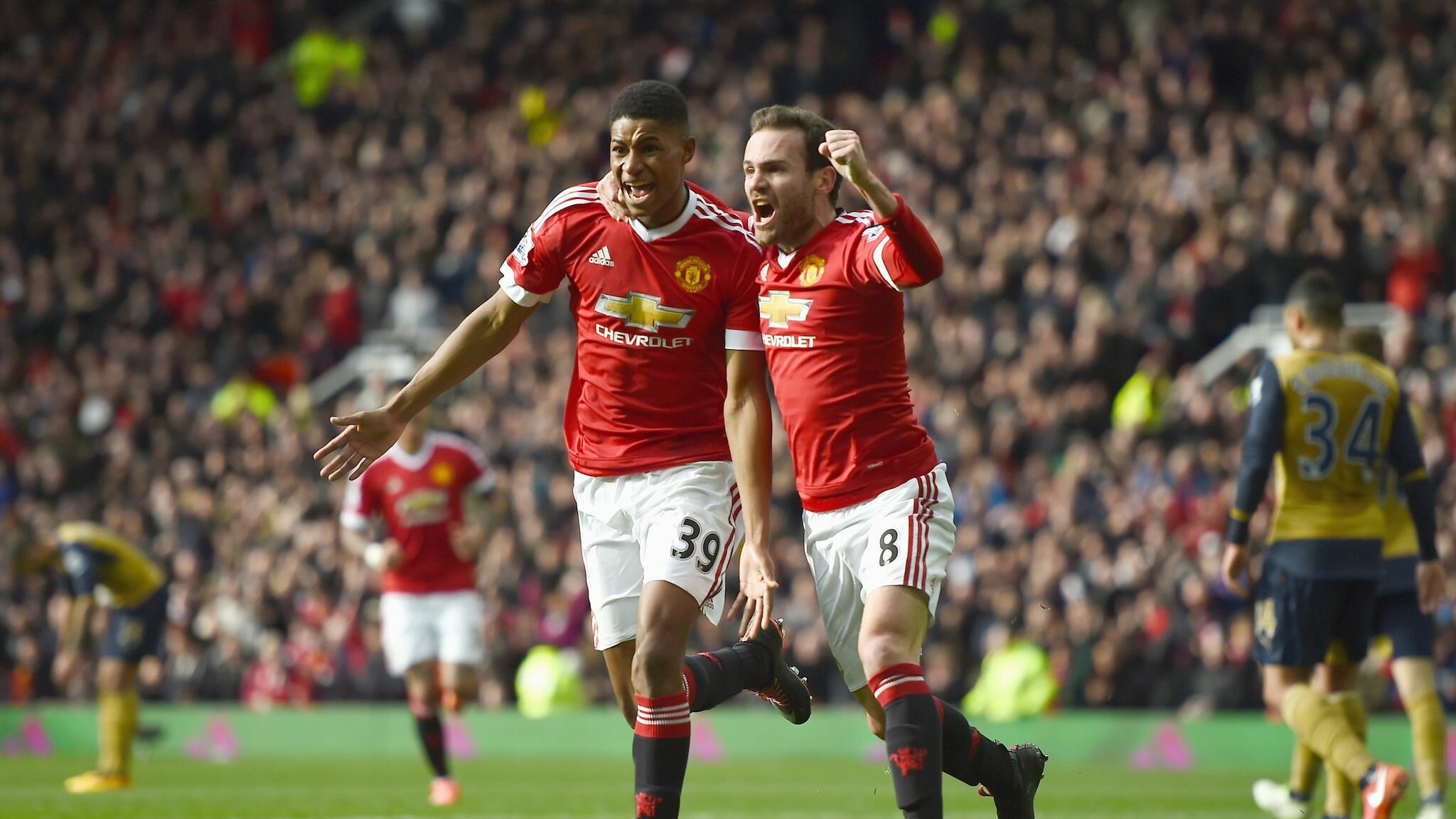 Marcus Rashford with Juan Mata after scoring against Arsenal on his Premier League debut